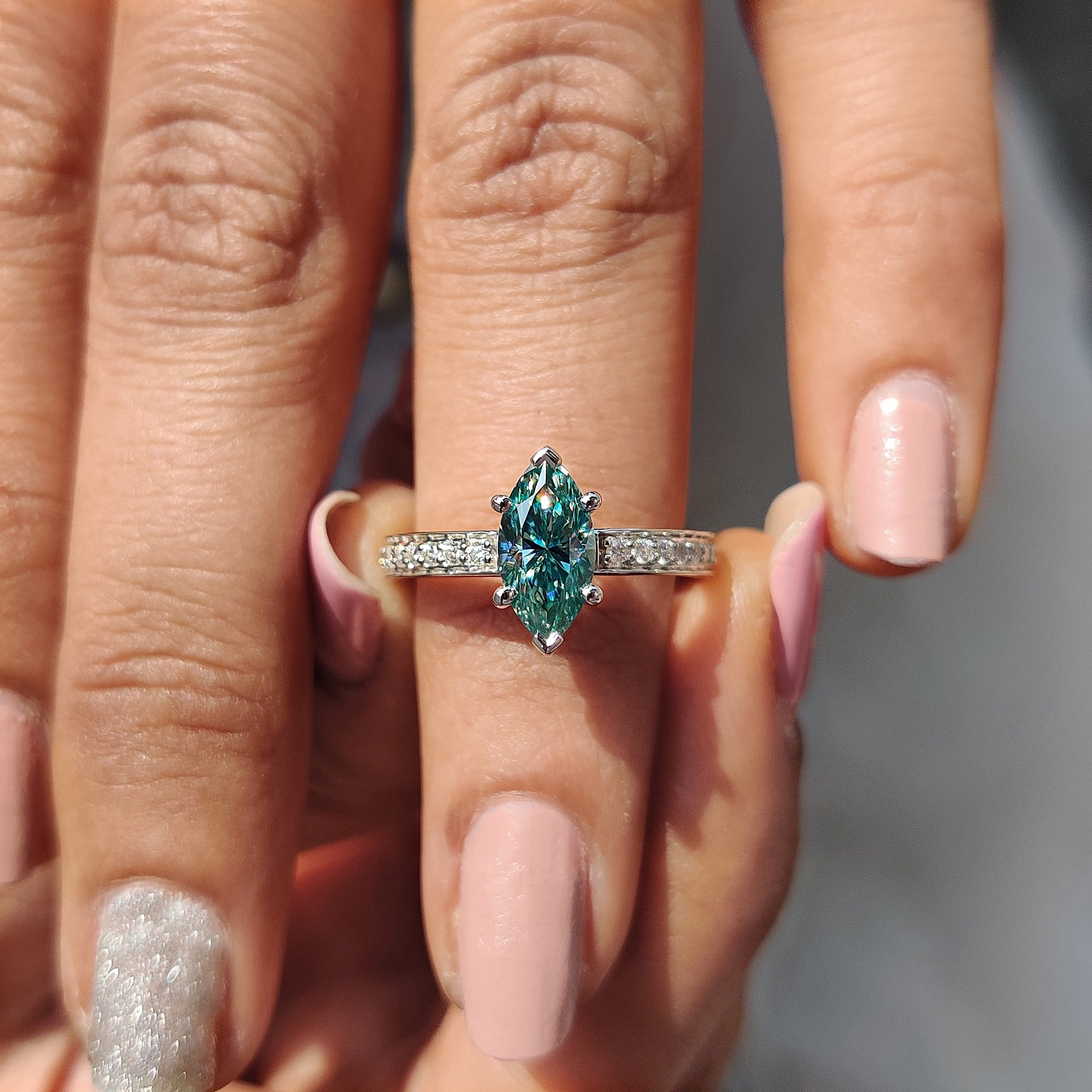 Buy engagement ring featuring a stunning marquise moissanite stone.