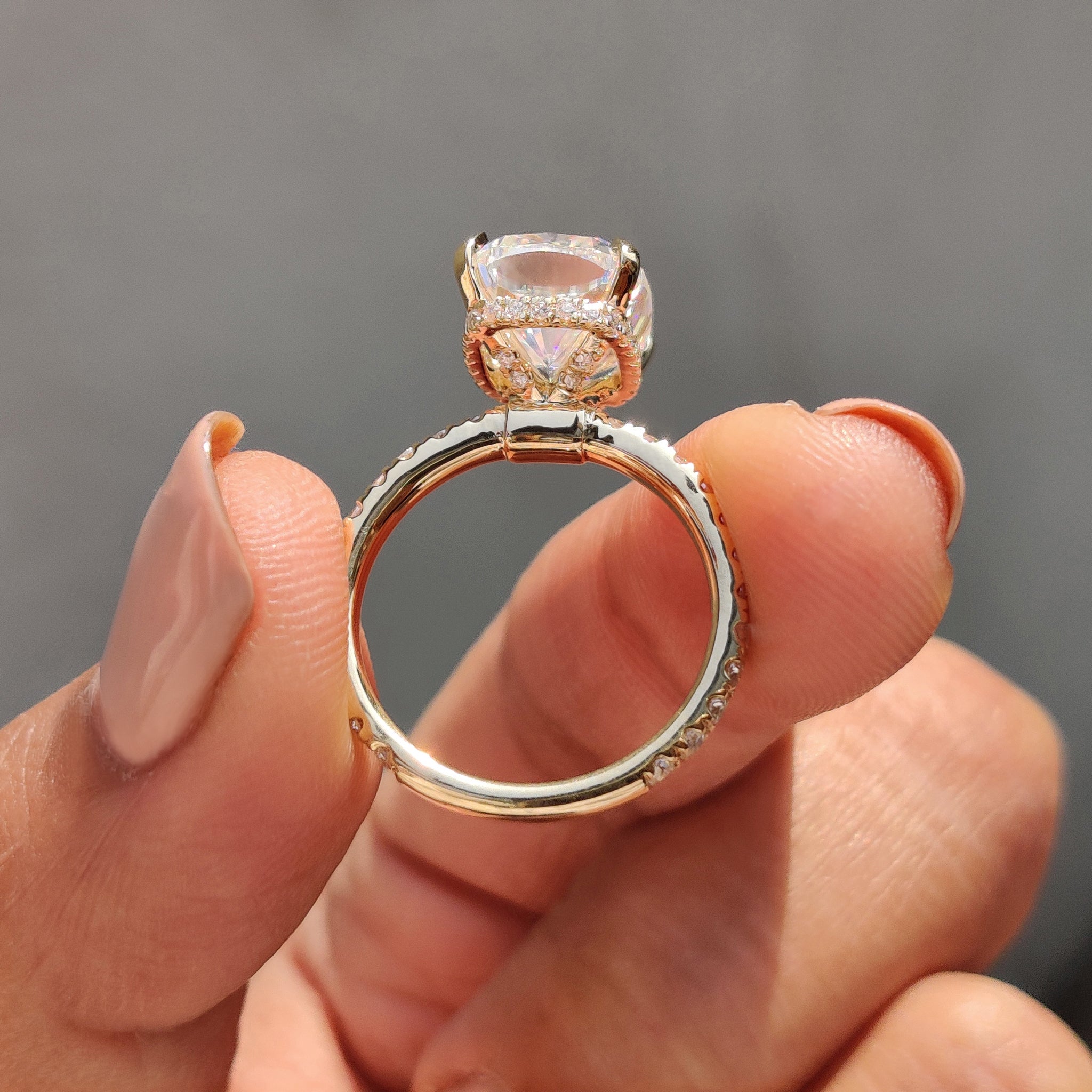 Cushion cut engagement ring featuring a hidden halo setting.
