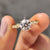 Round cut moissanite engagement ring shines with perfect brilliance.
