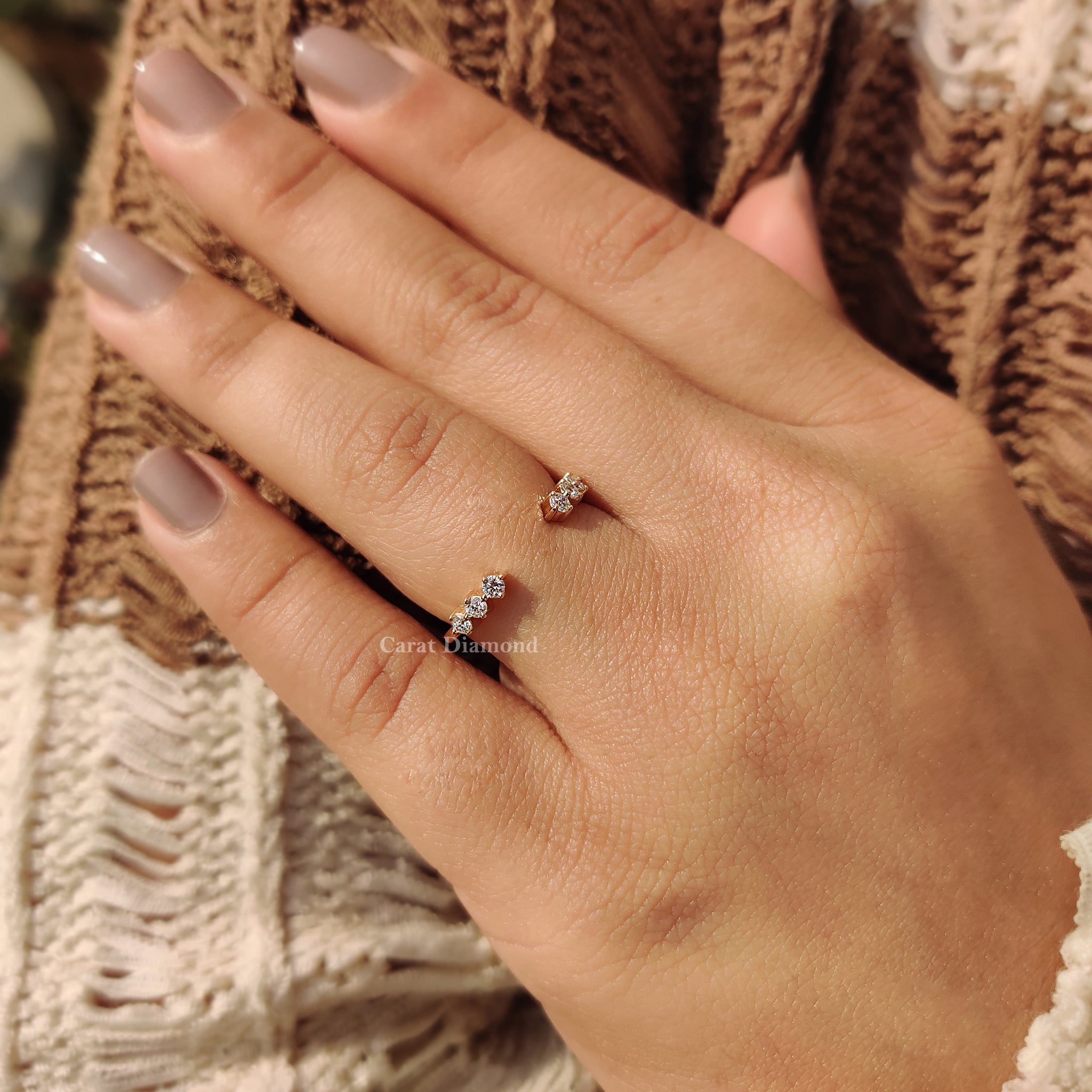 Yellow gold band displayed on a velvet surface.
