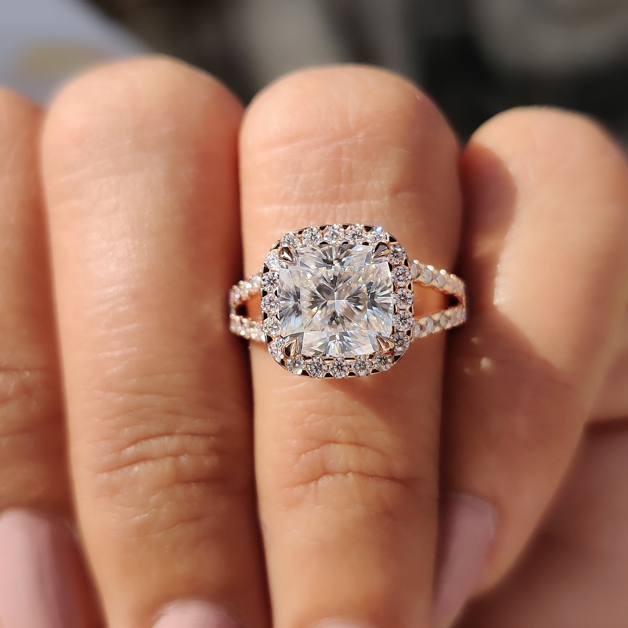 Handmade jewelry featuring a round cut split pave set band and a 4 claw prong setting for a unique engagement ring style.
