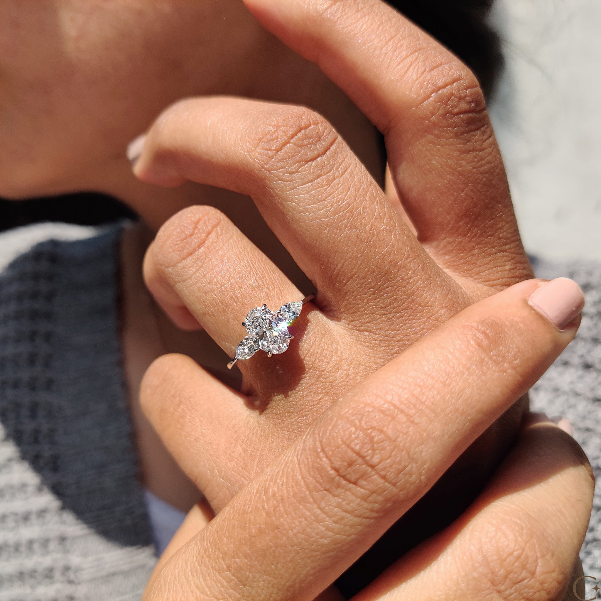 4 prong claw setting engagement ring with a brilliant diamond.
