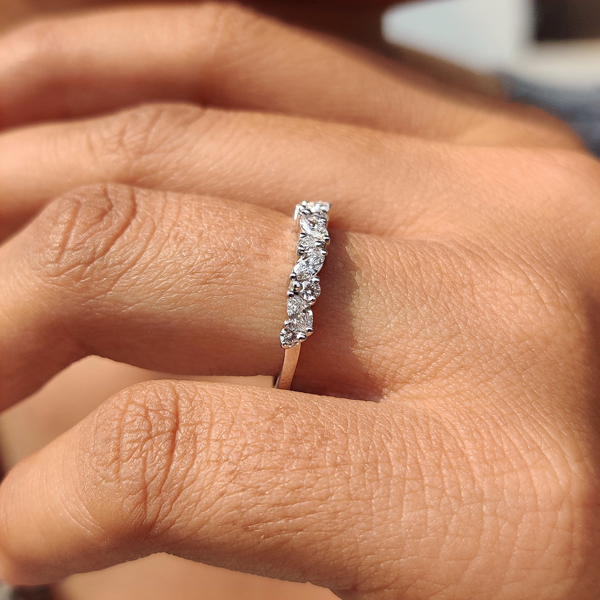 Custom wedding band with marquise and round diamonds.