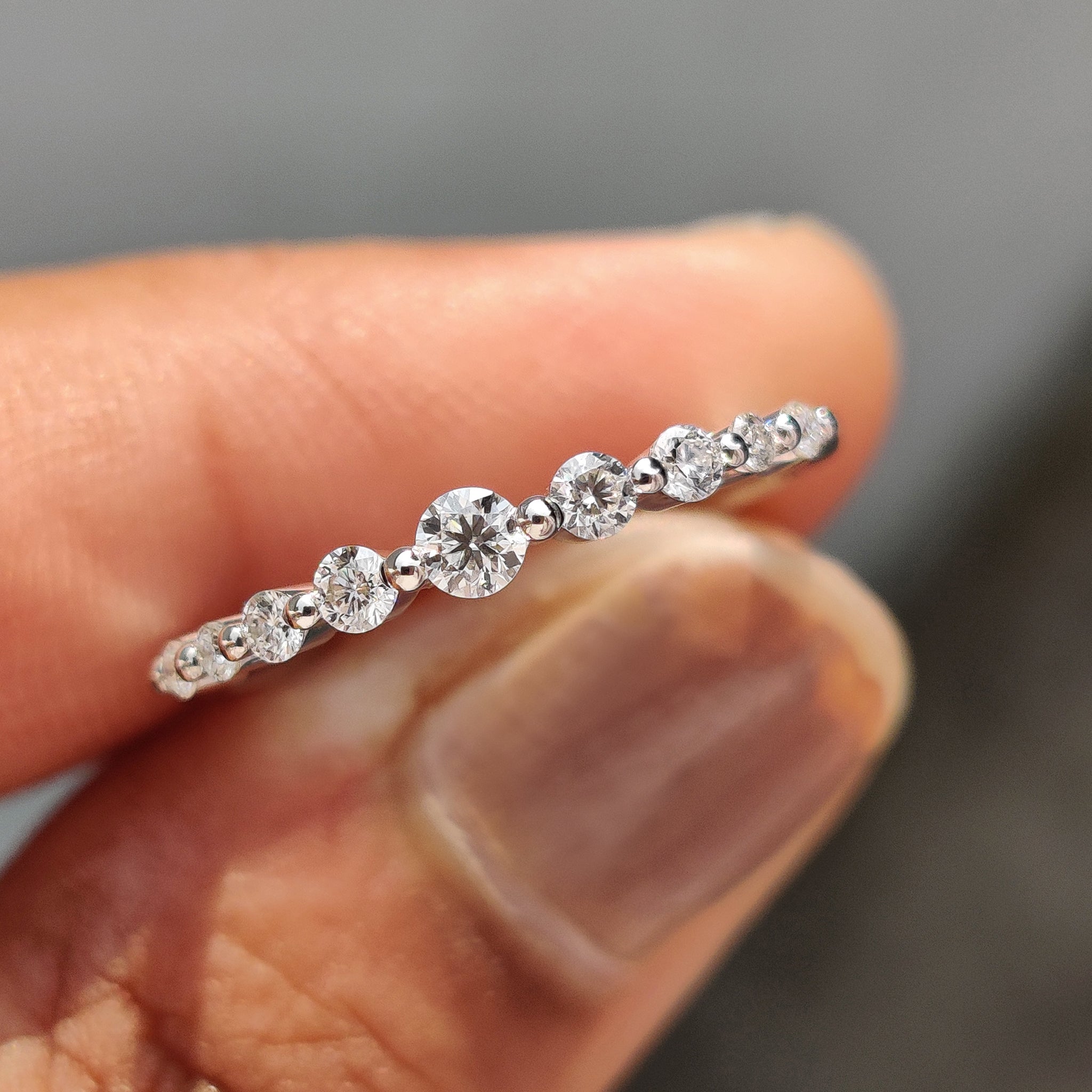 7 stone wedding band with sparkling round diamonds.