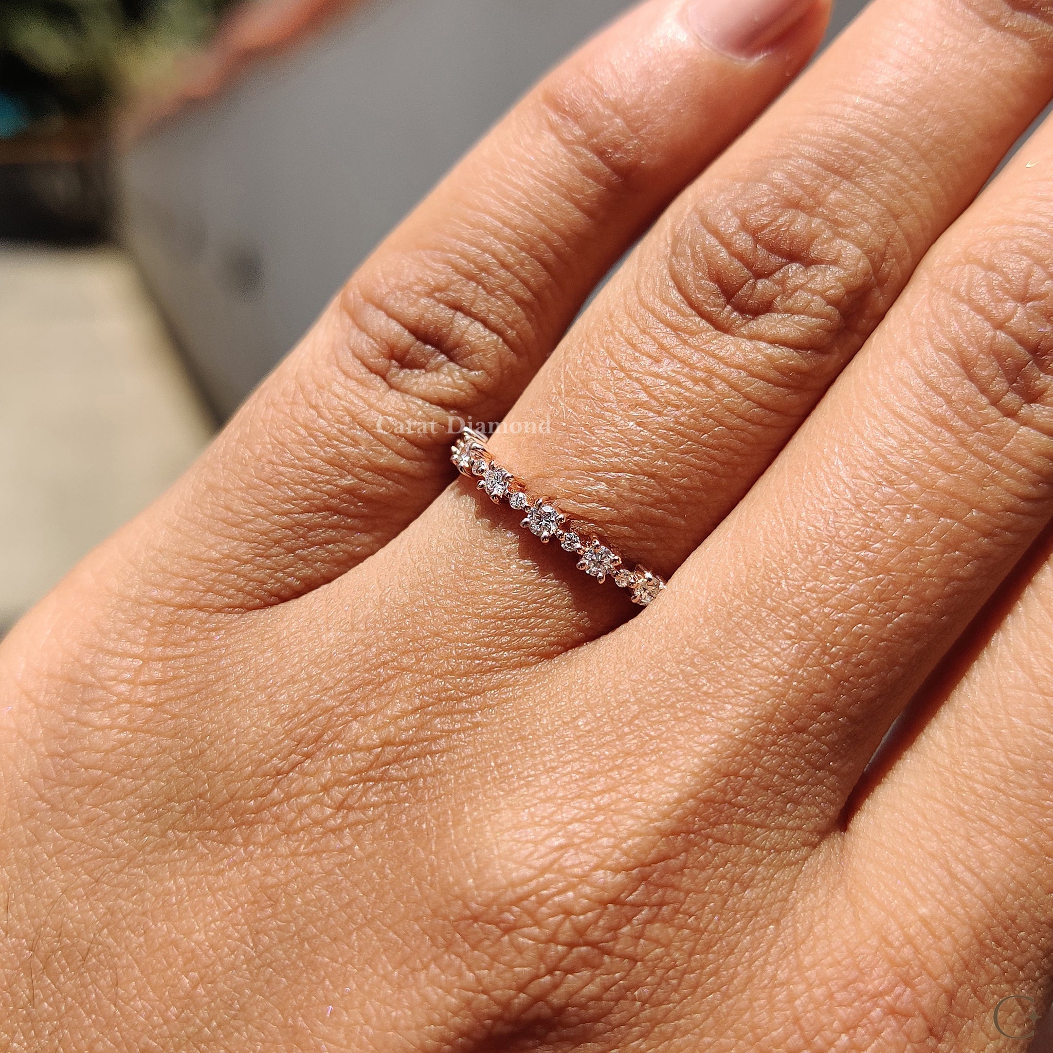Prong set band showcasing stunning round diamonds.