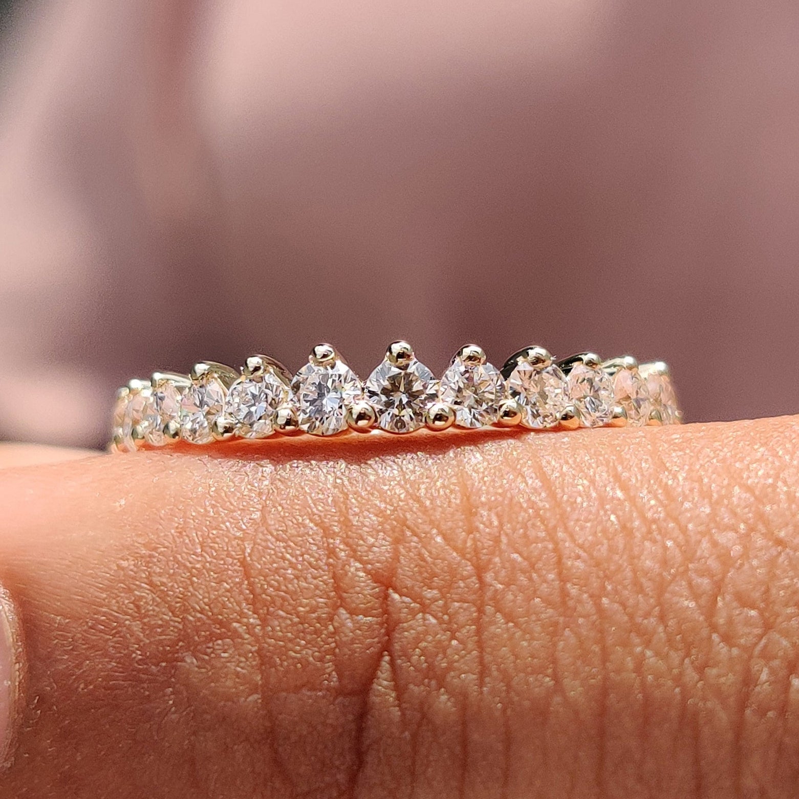 Half eternity diamond band with sparkling round diamonds.
