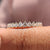 Half eternity diamond band with sparkling round diamonds.
