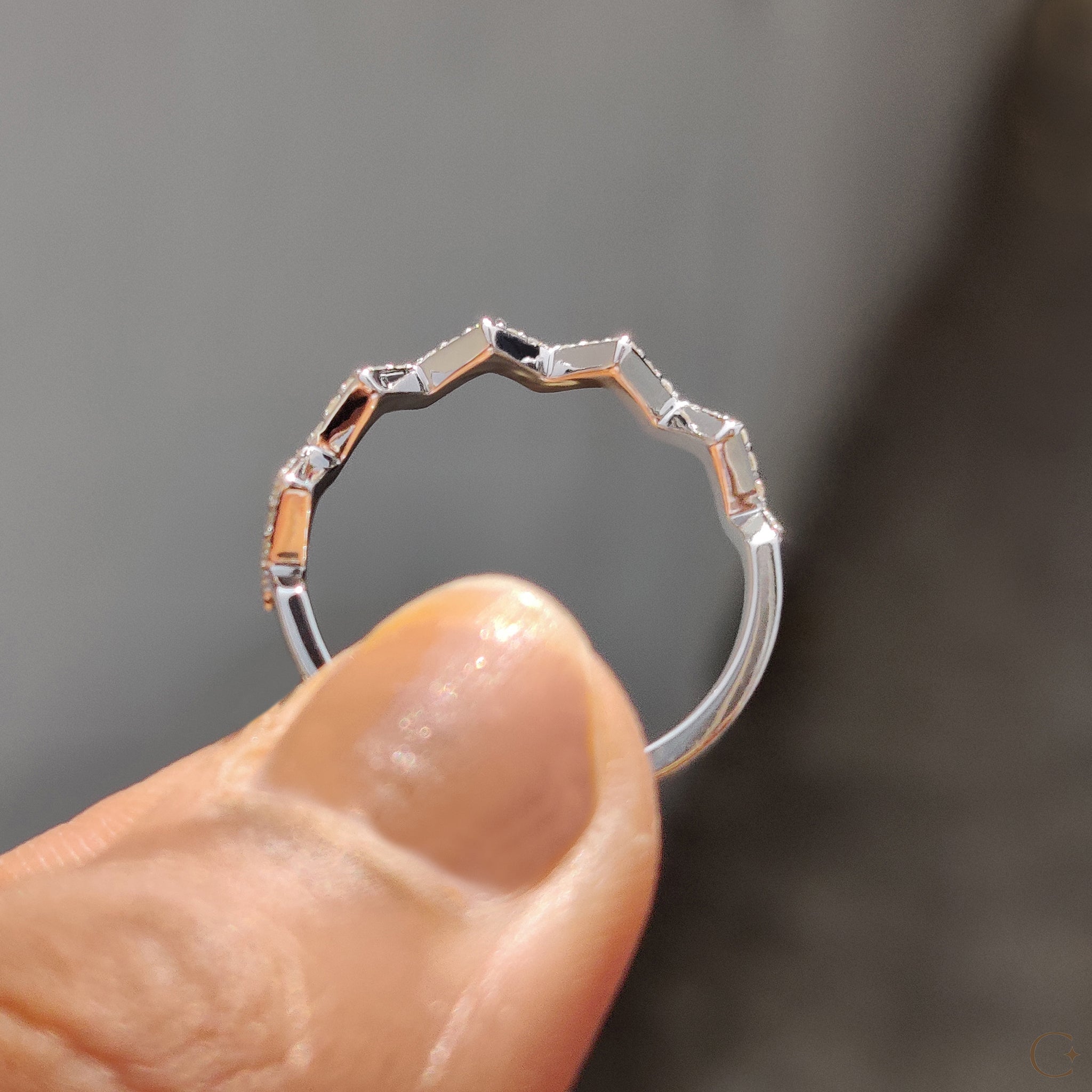 Handmade jewelry band with round cut diamonds.
