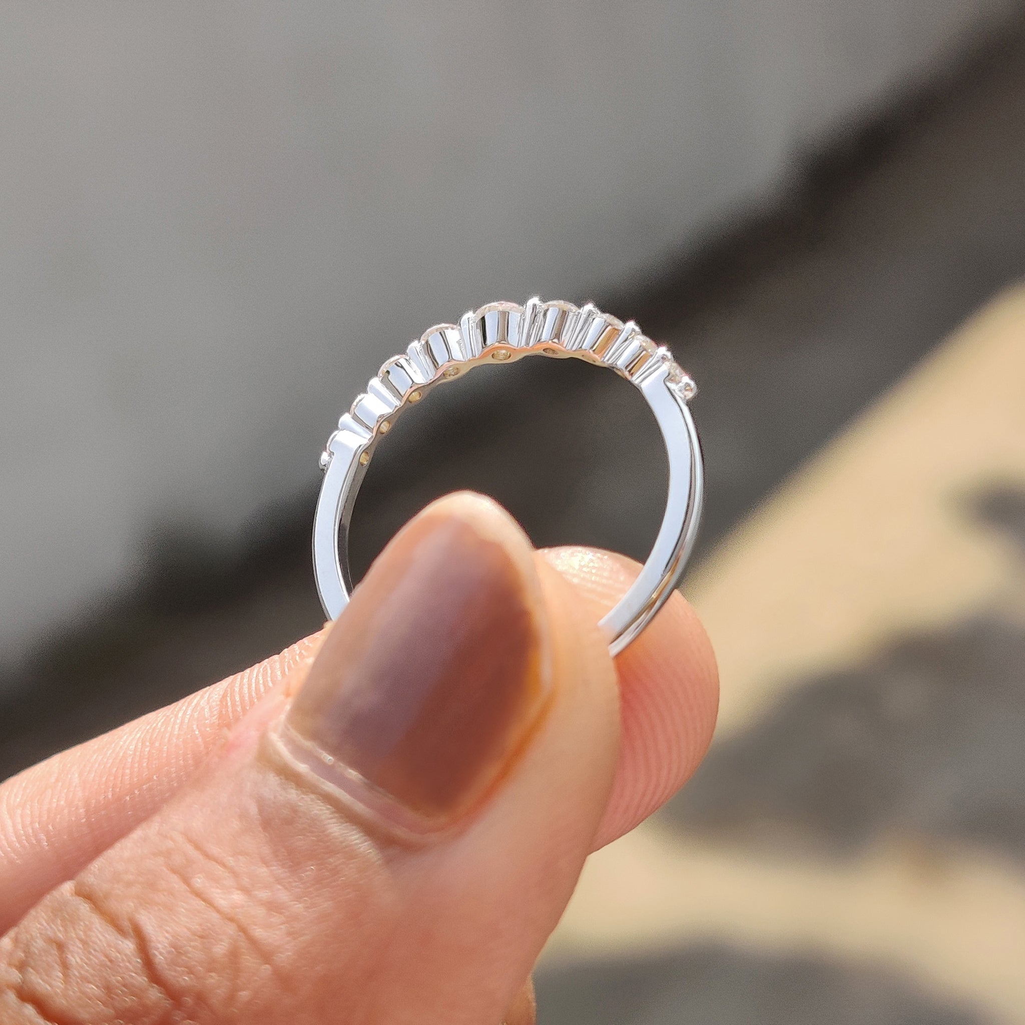 Carat Diamonds wedding band with seven stones.

