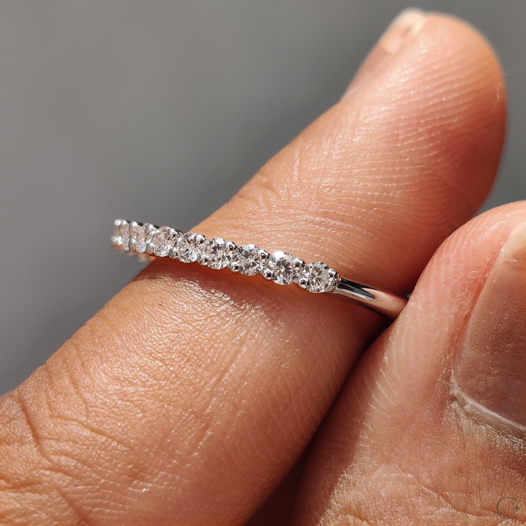 White gold half eternity band crafted for timeless elegance.
