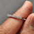 White gold half eternity band crafted for timeless elegance.
