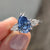 Pear cut moissanite ring with brilliant sparkle
