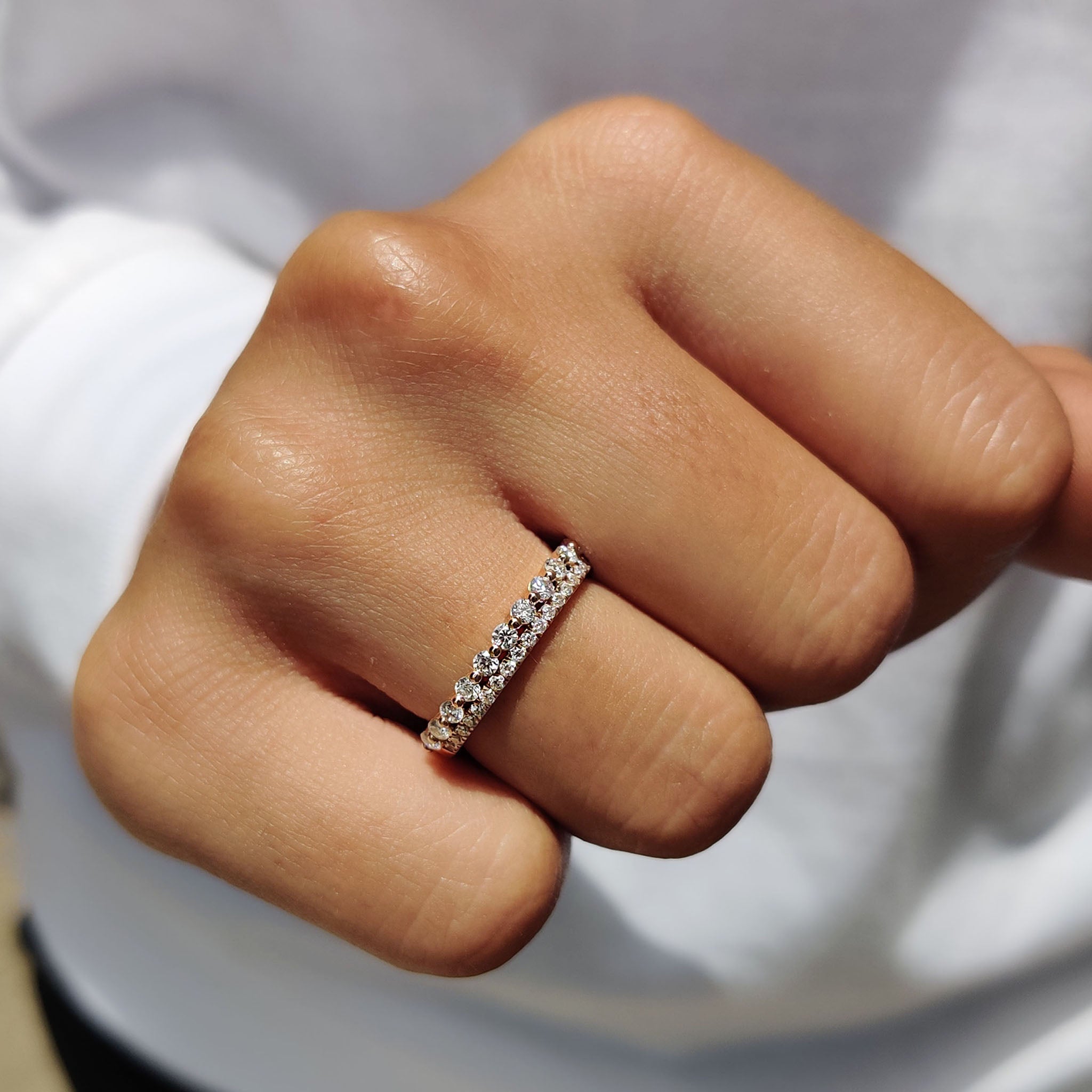 Moissanite wedding band shines with bold style.