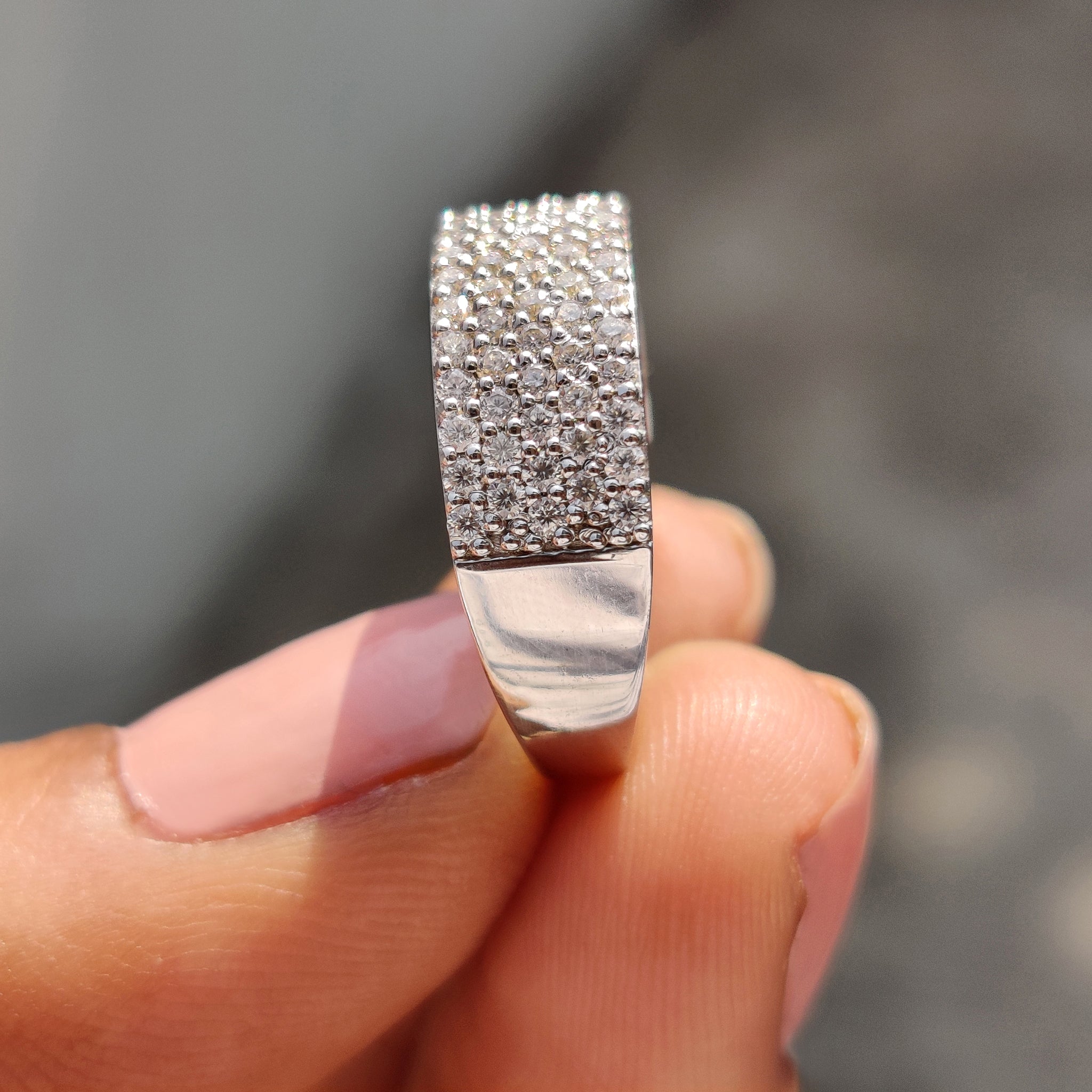 Pave wedding band with closely set moissanite for a continuous shimmer effect.