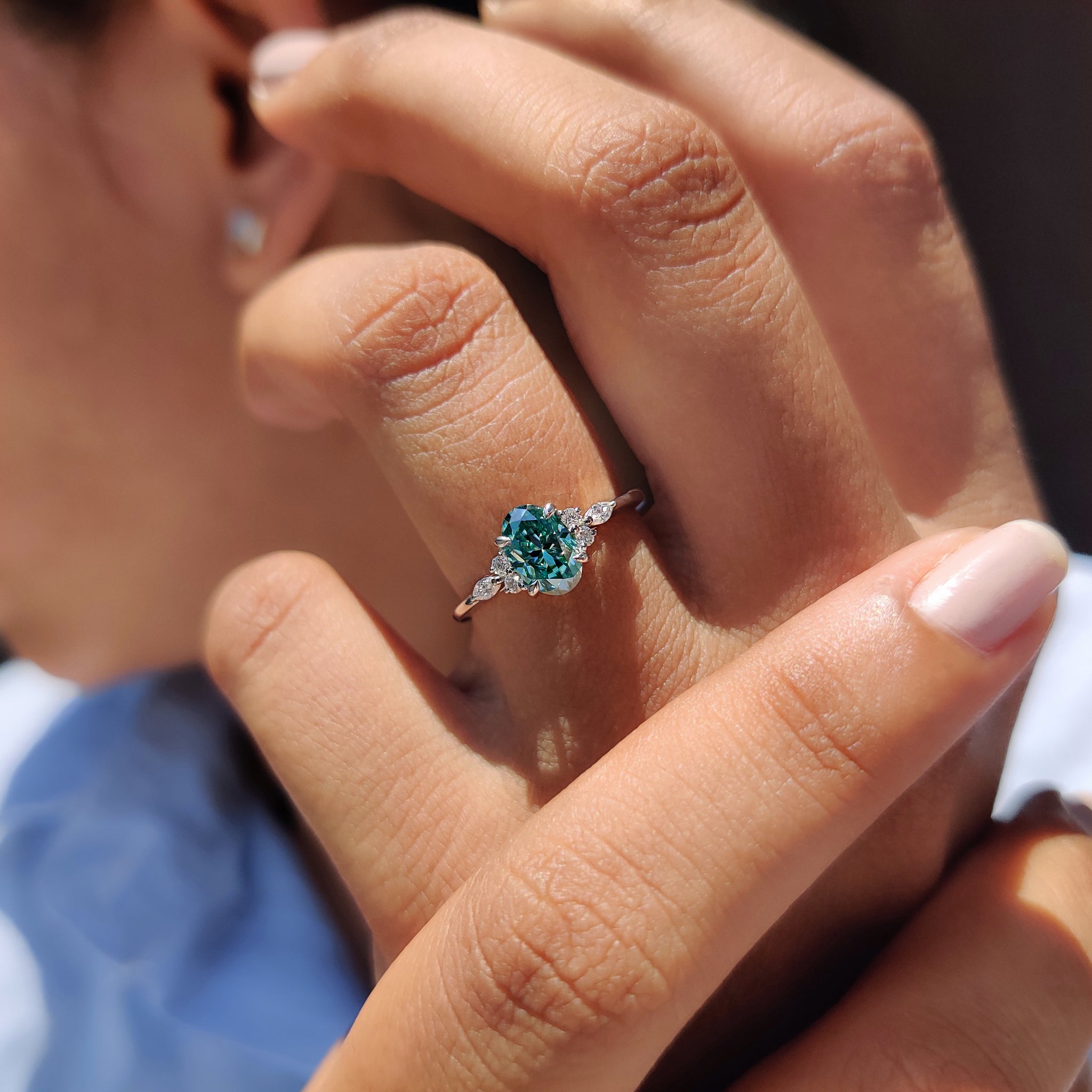 Special gifts for her featuring a 7 stone moissanite ring in white gold.
