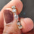Yellow gold wedding band featuring round cut moissanite, offering a classic and durable design.