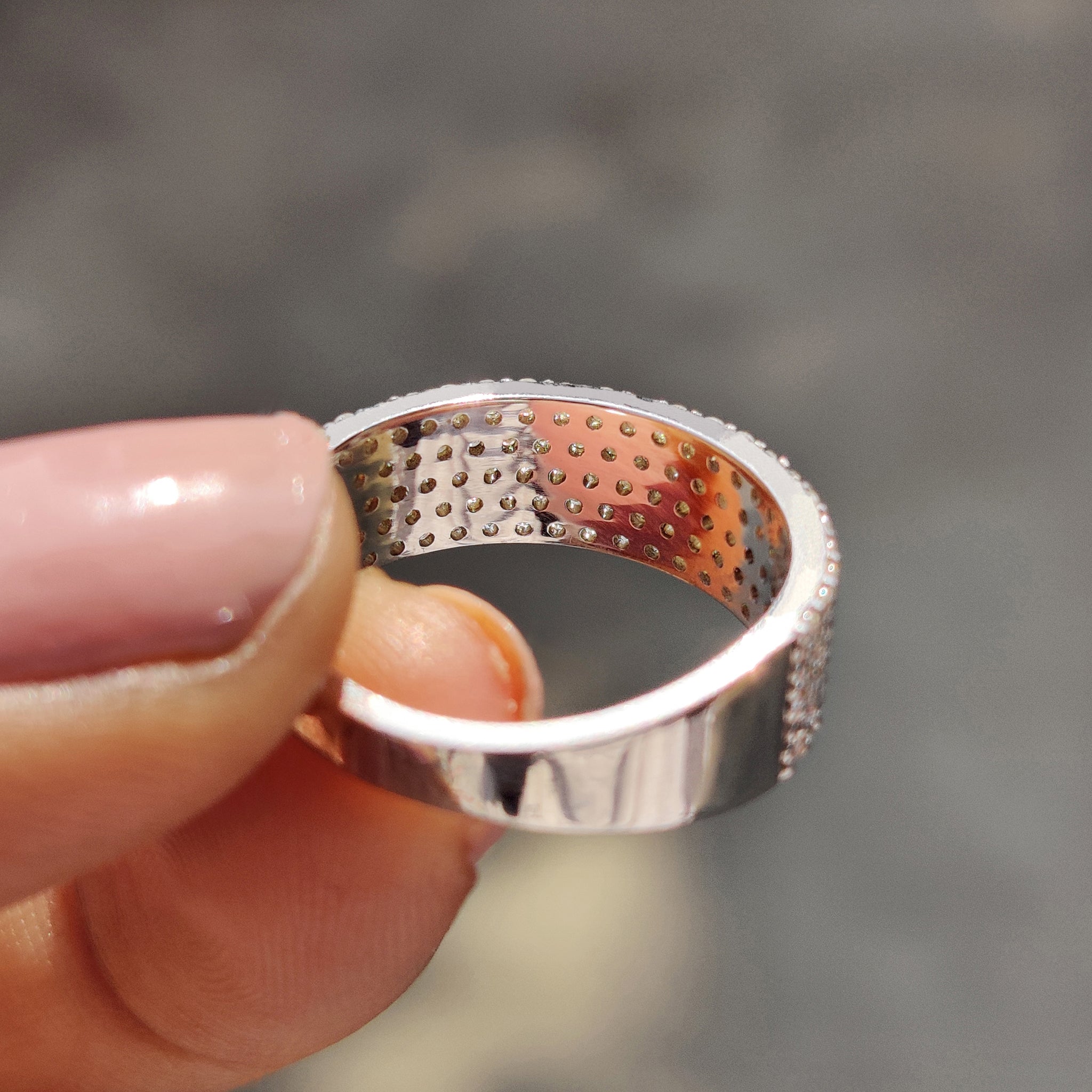 White gold wedding band with round cut moissanite for a clean and elegant look.