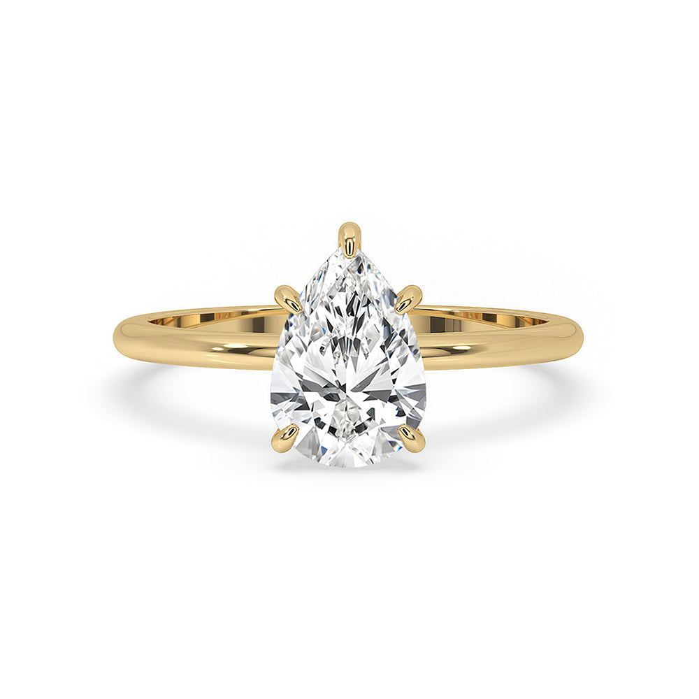 Pear shaped engagement ring in solitaire setting with yellow gold band.
