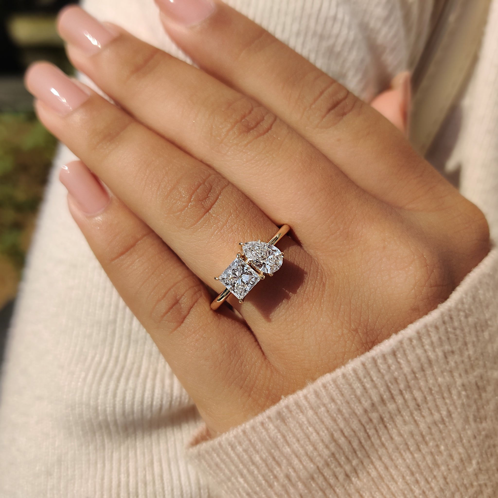 A stunning toi et moi ring lab grown with a unique combination of princess cut and pear cut diamonds in a classic prong setting.
