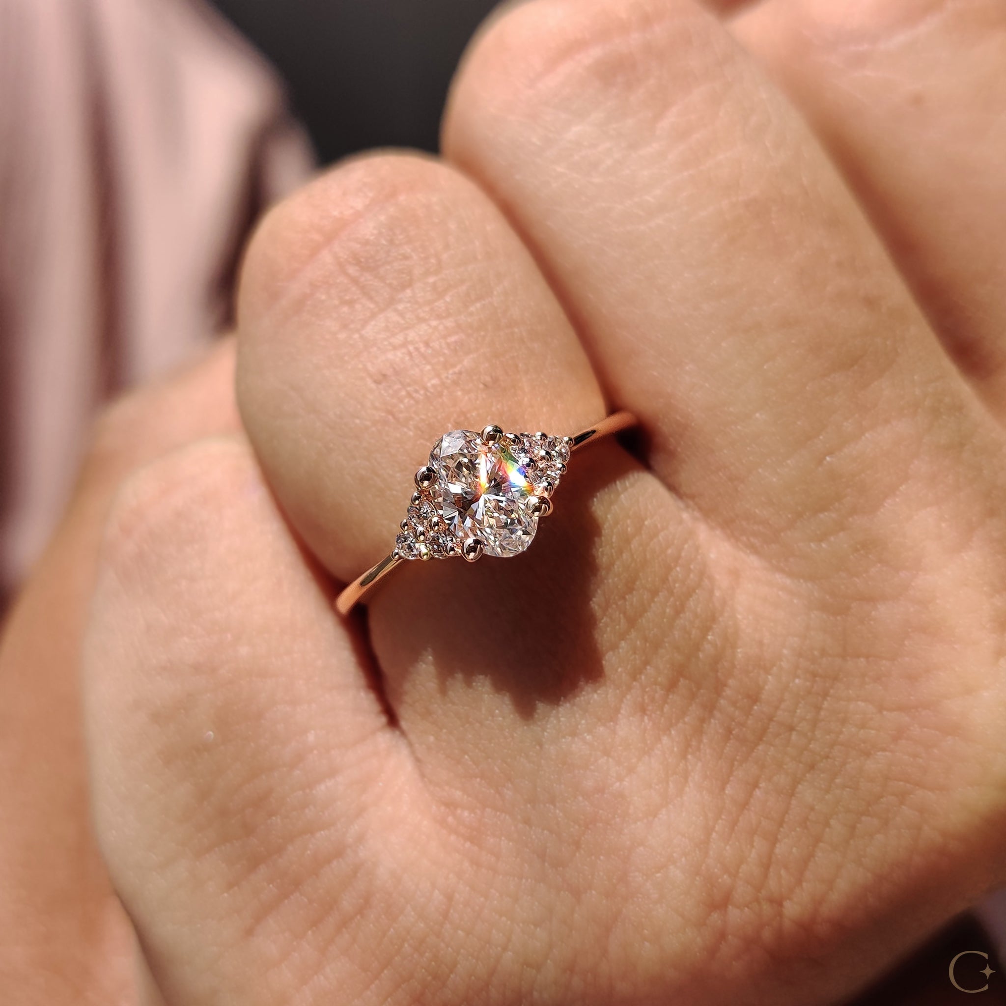 Muse setting engagement ring with sparkling side stones.
