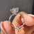 Round cut engagement ring designed in white gold with clean lines.

