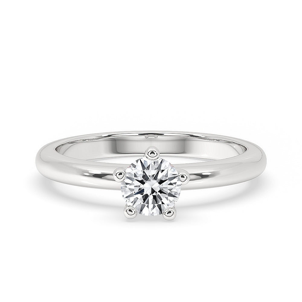 Radiant cut ring in a solitaire setting with white gold band.
