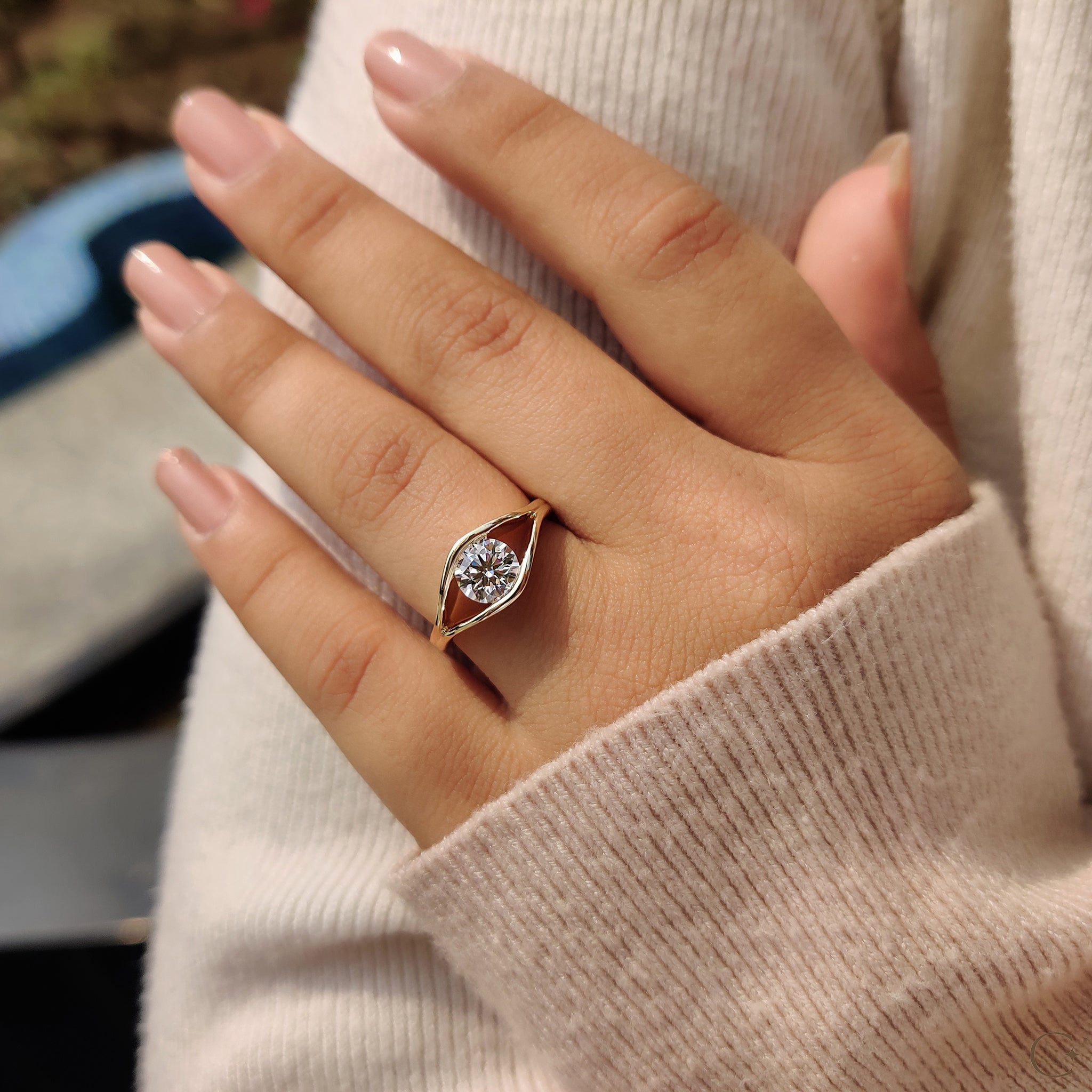 A round cut ring set in yellow gold
