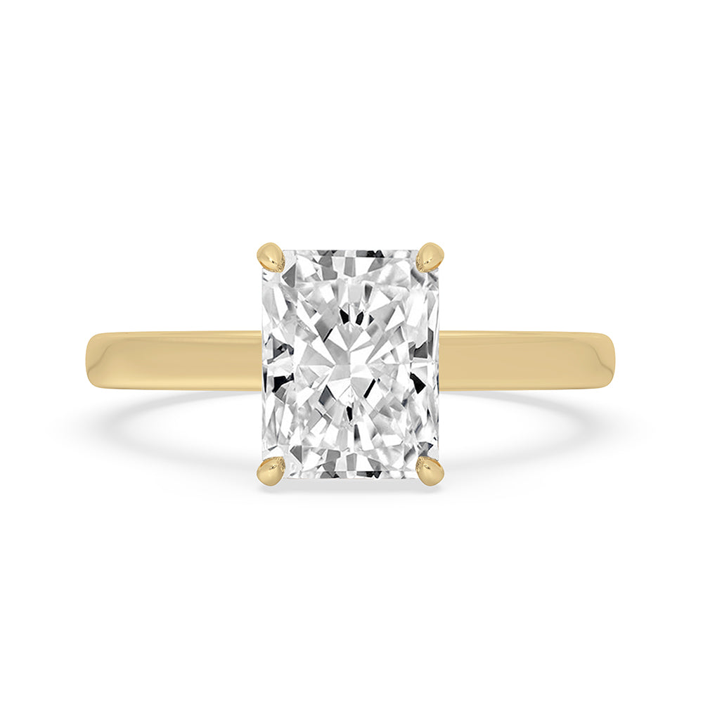 Radiant cut gold engagement ring with solitaire diamond.
