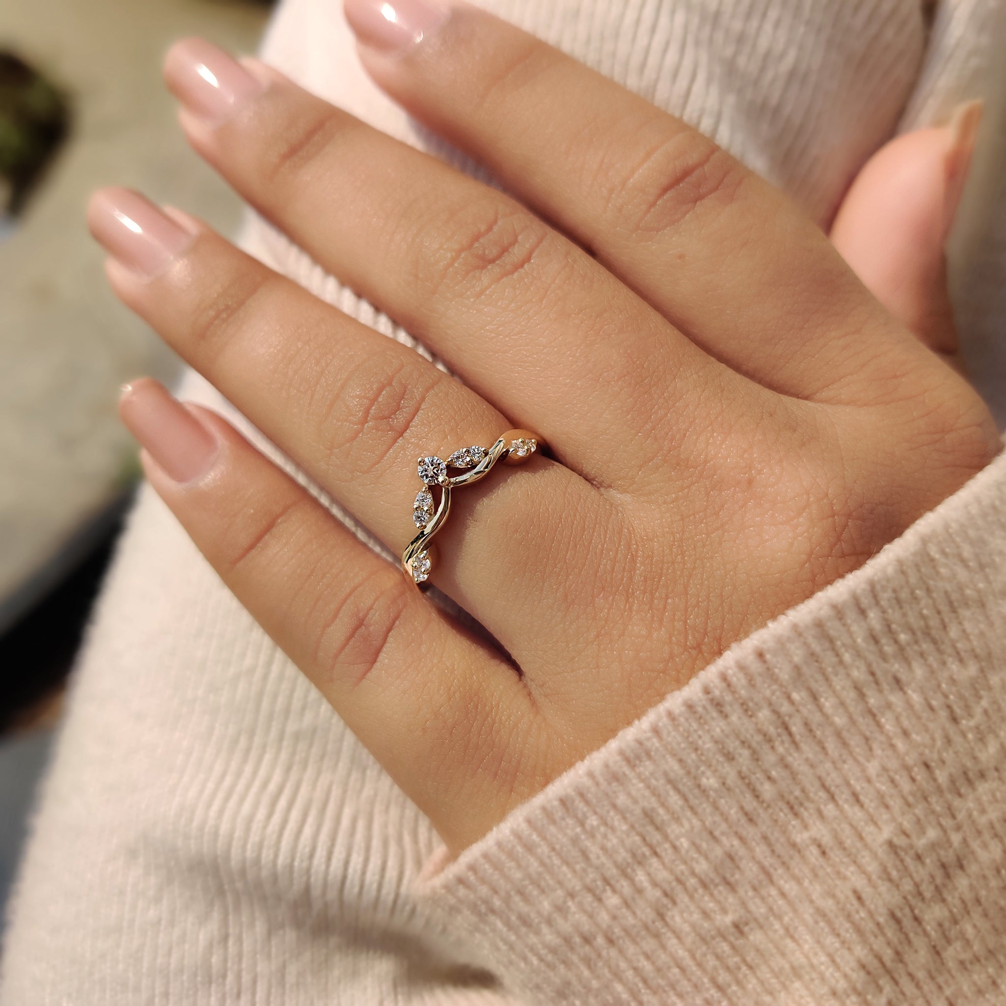 Crown wedding band with intricate design details.
