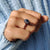Black round cut ring featuring a striking contrast.