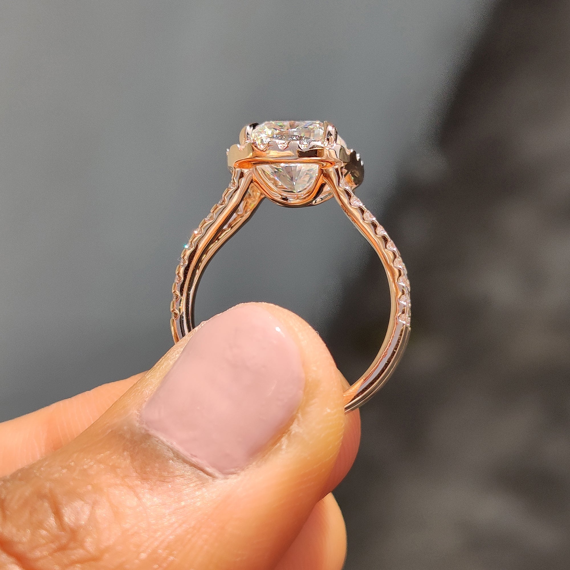 Elegant cushion cut ring in rose gold with a halo setting, great for those seeking handmade jewelry with sparkle.
