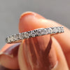Half Eternity Wedding Band with round moissanite stones in white gold.