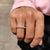 Round cut moissanite band with smooth edges.