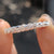 Twisted eternity band with round moissanite stones
