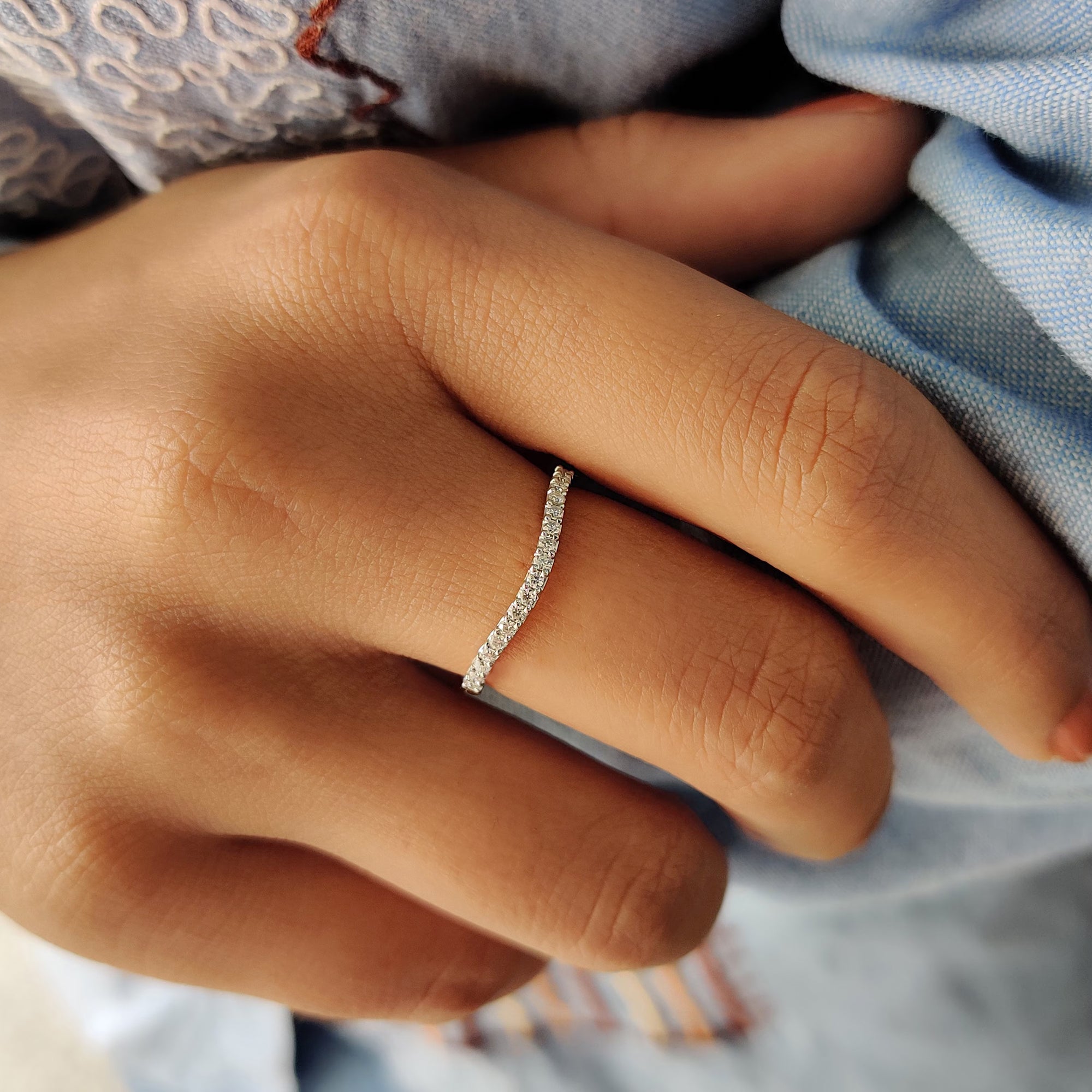 Round Cut Wedding Band with sparkling moissanite stones.

