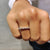 Shared prong eternity band featuring alternating round and baguette moissanite stones in white gold.