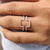 White gold band designed to fit around center stones as a ring enhancer.
