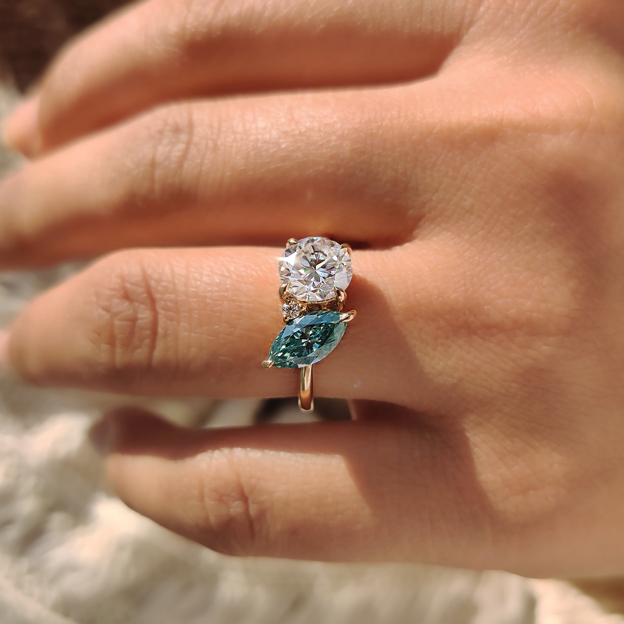 2 round cut moissanite stones add sparkle to life.
