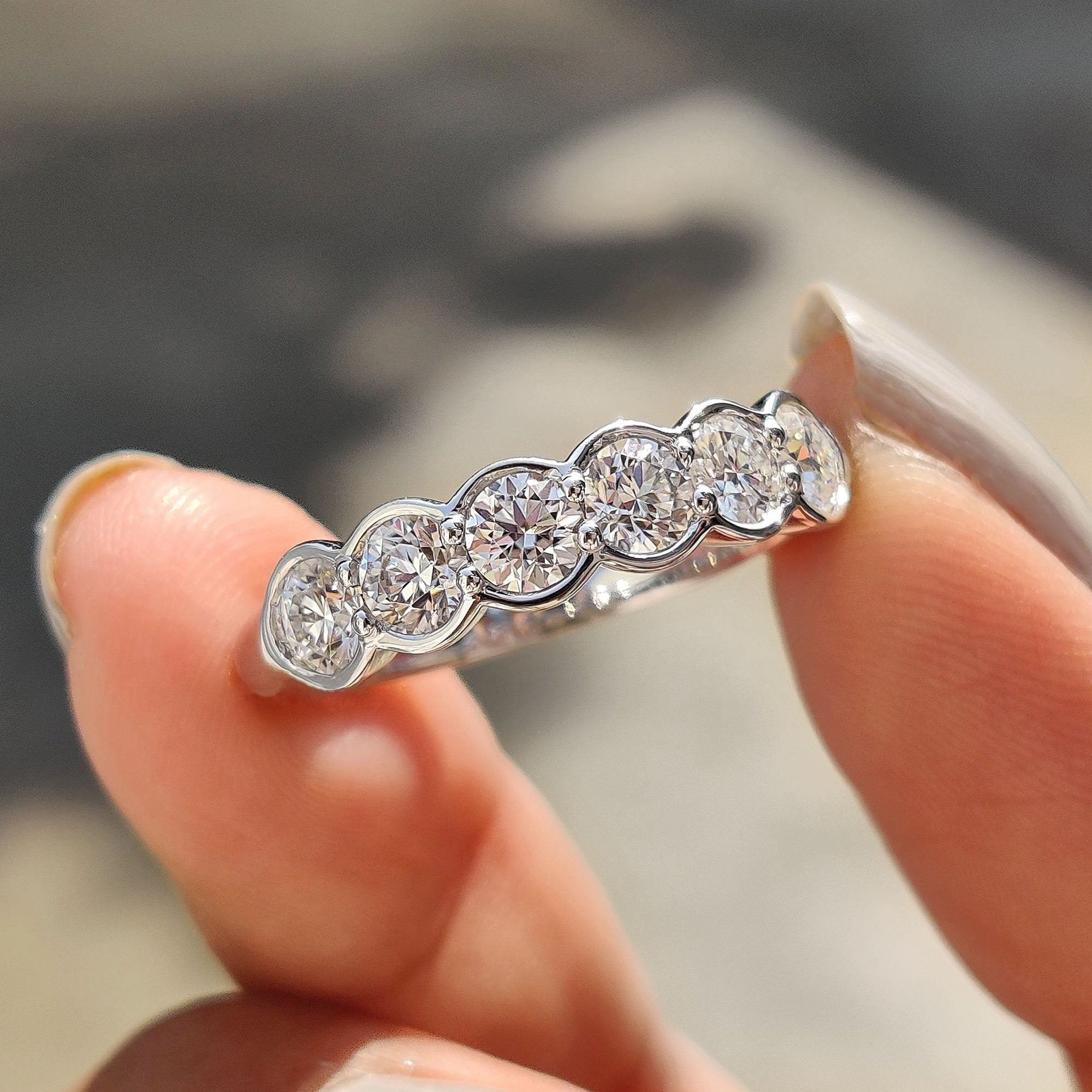 6 stone wedding band designed with brilliant round cut diamonds for added shine.
