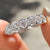6 stone wedding band designed with brilliant round cut diamonds for added shine.
