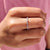 Moissanite wedding band shines with subtle charm.