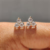 3 Stone Stud Earring designed with round cut Moissanite earrings in yellow gold earrings setting.
