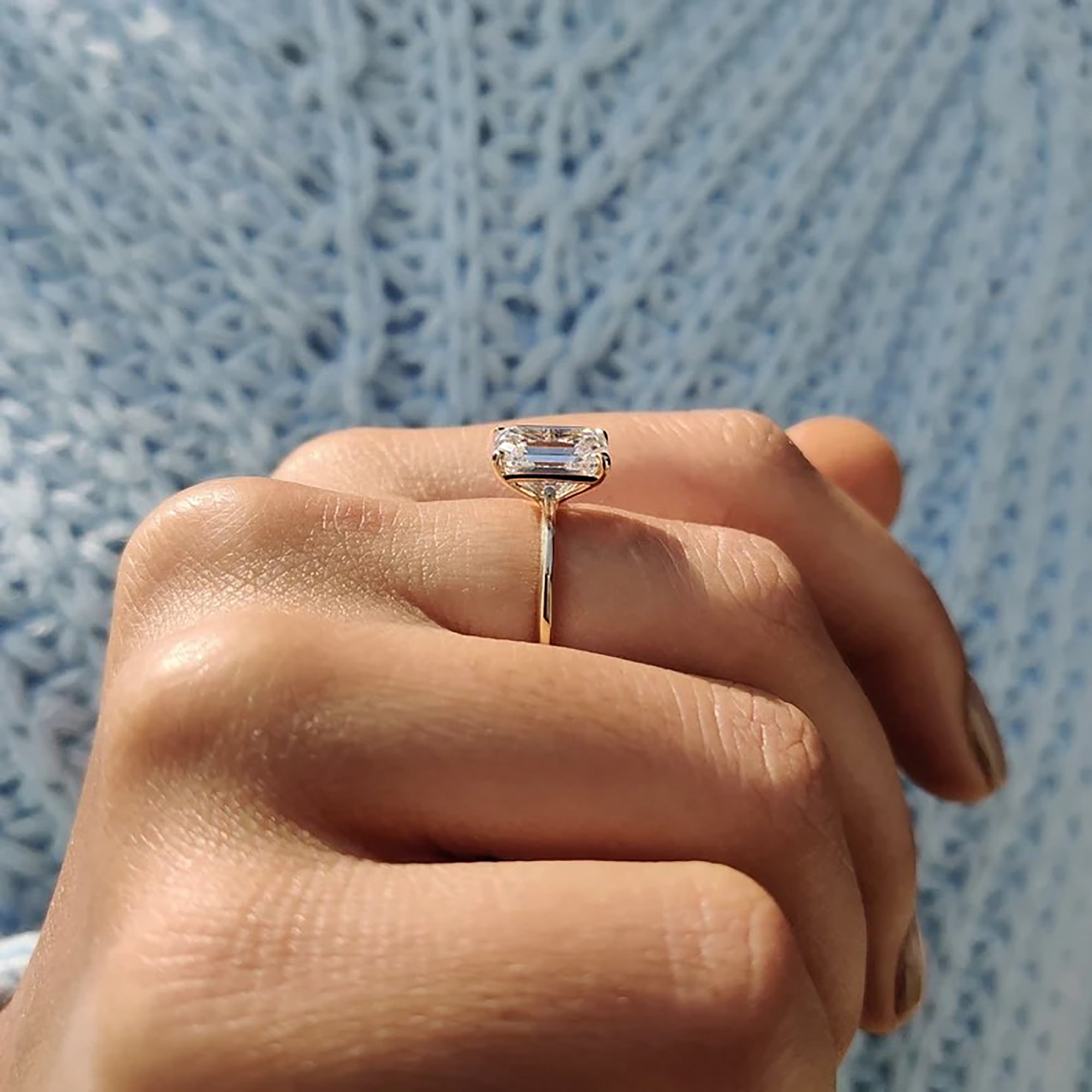 Solitaire moissanite ring crafted in knife edge style.
