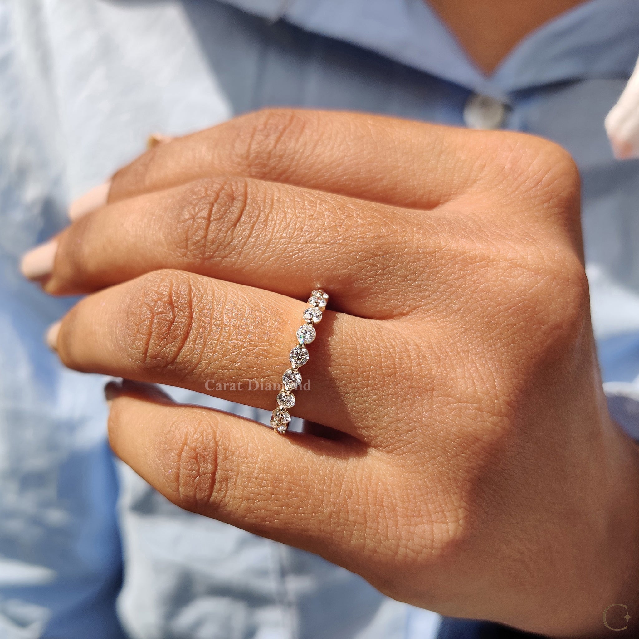 Shared prong setting highlighting brilliant round diamonds.