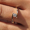 Bypass diamond ring with a sleek twisted design.
