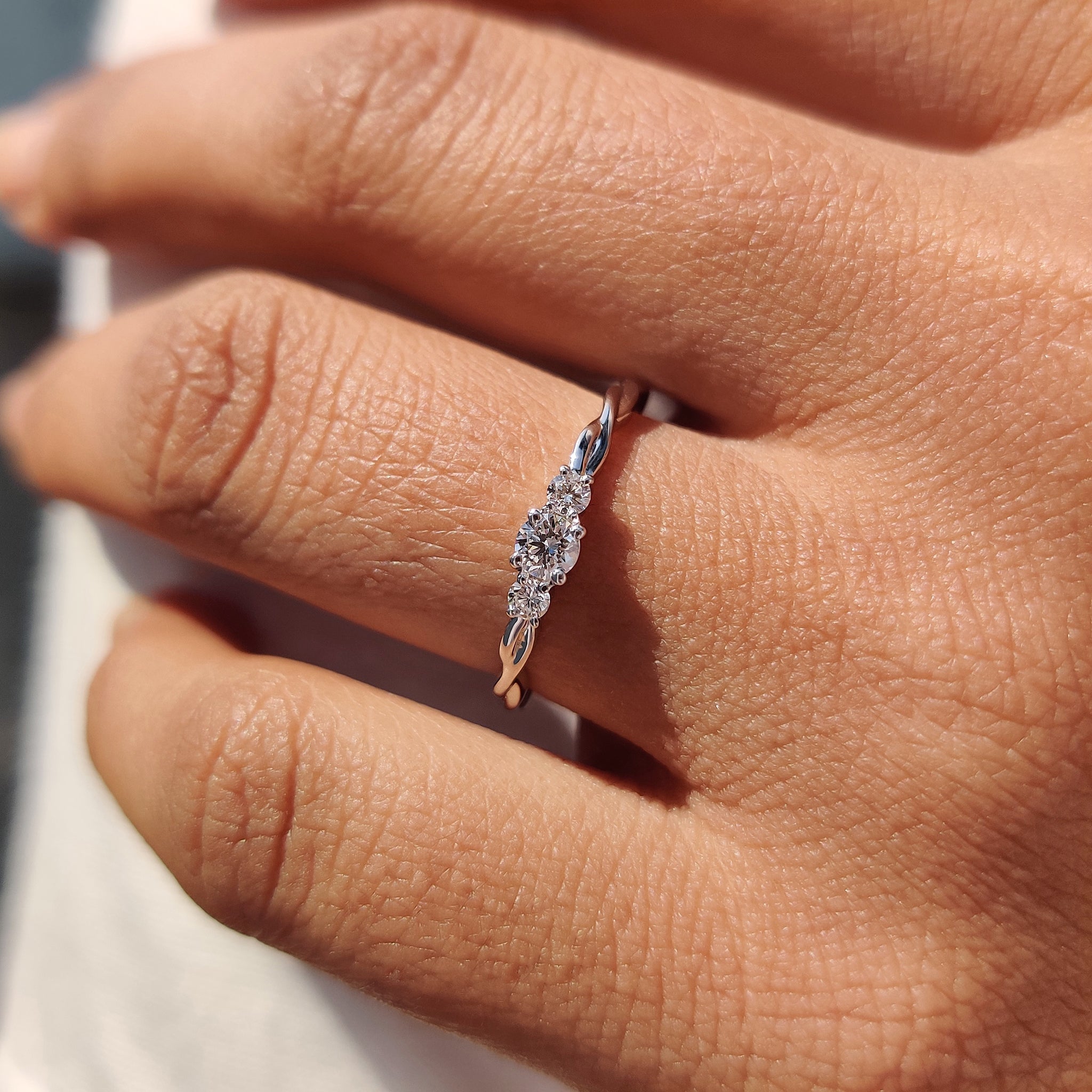 White gold engagement ring with lab-grown diamond center.
