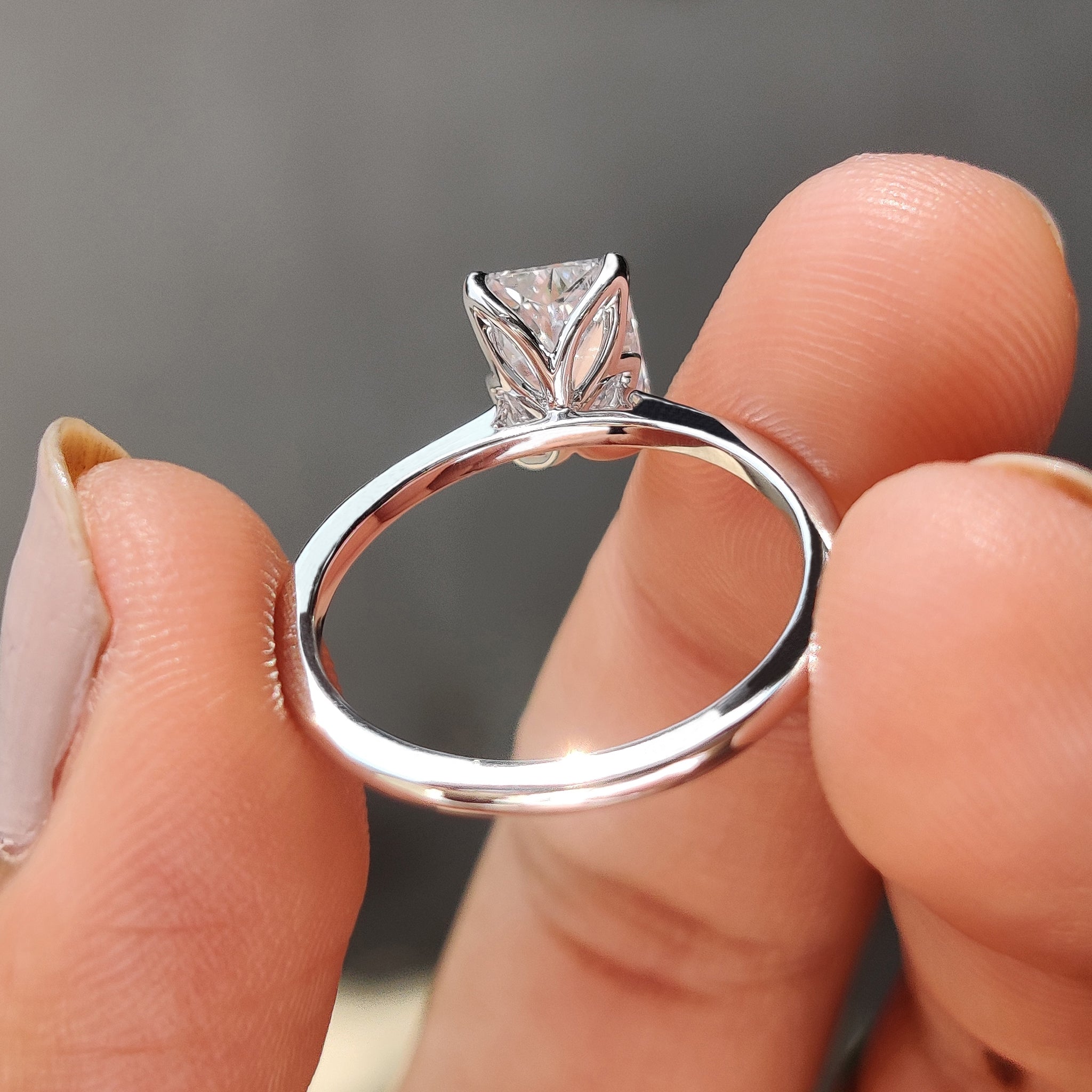 Radiant cut solitaire ring with sparkling brilliance.
