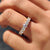 Round diamond half eternity band in yellow gold.
