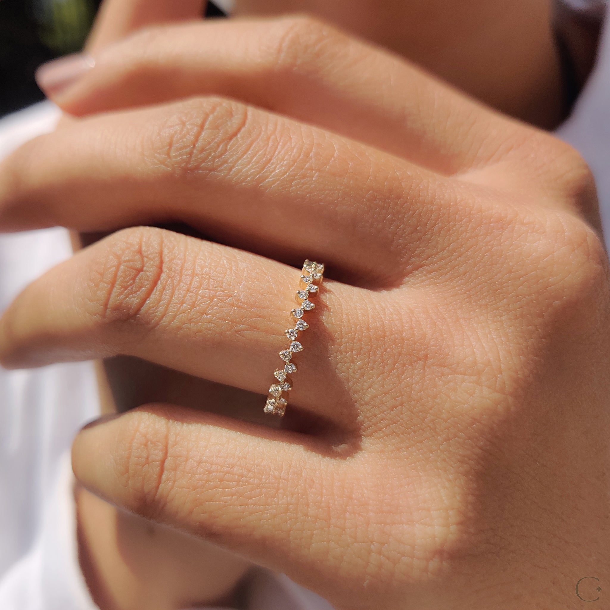 Half eternity wedding band with delicate diamond detailing.
