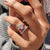 4 prong claw setting engagement ring with a brilliant diamond.
